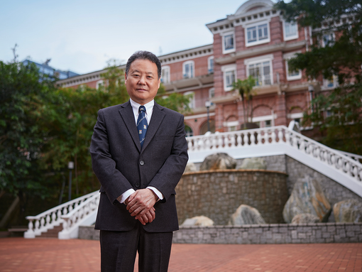Professor Yang Rui standing in front of Chong Yuet Ming Fountain 